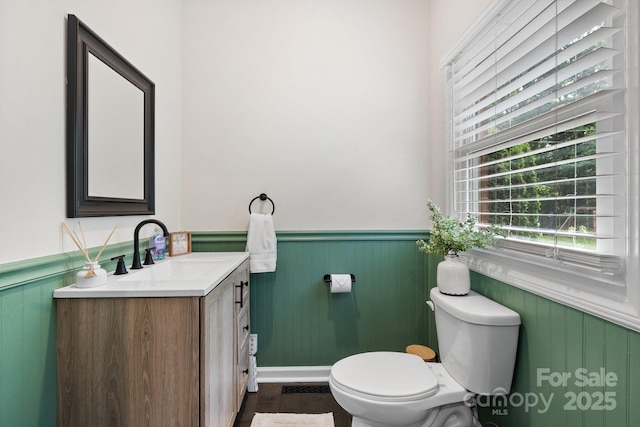 4916 Leepers Creek Rd, Maiden, NC 28650 - bathroom with wainscoting, vanity, toilet, and wood finished floors