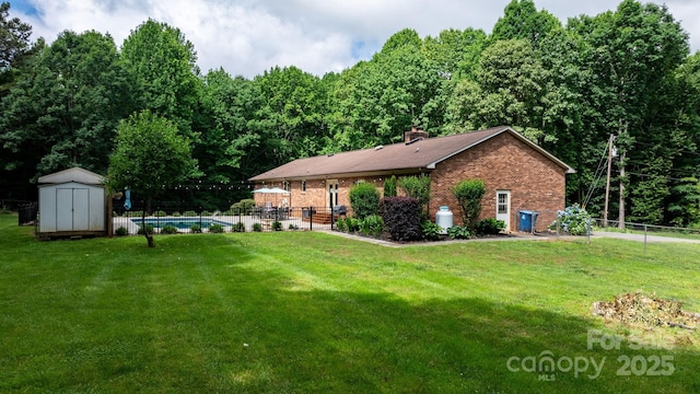 4916 Leepers Creek Rd, Maiden, NC 28650 - back of house with brick siding, a chimney, and a forest view