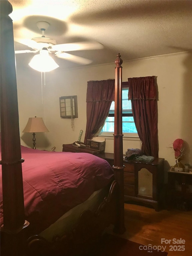 3715 Vanderburg Dr, Concord, NC 28025 - bedroom featuring wood finished floors, ceiling fan, and a textured ceiling