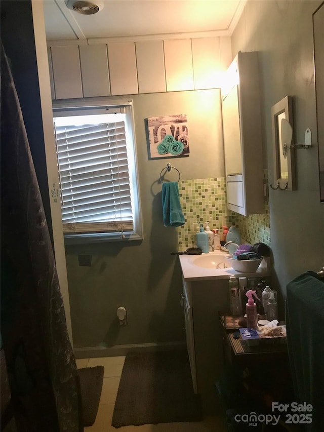 3715 Vanderburg Dr, Concord, NC 28025 - full bathroom featuring vanity and decorative backsplash