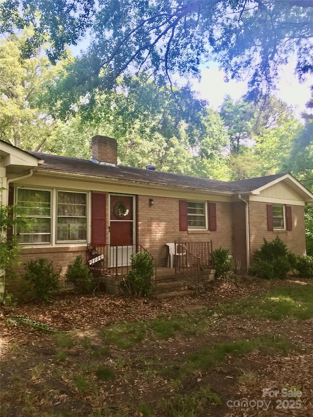 3715 Vanderburg Dr, Concord, NC 28025 - ranch-style house featuring a chimney and brick siding