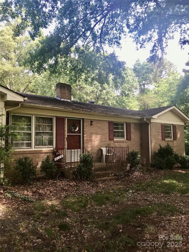 3715 Vanderburg Dr, Concord, NC 28025 - ranch-style home with brick siding and a chimney