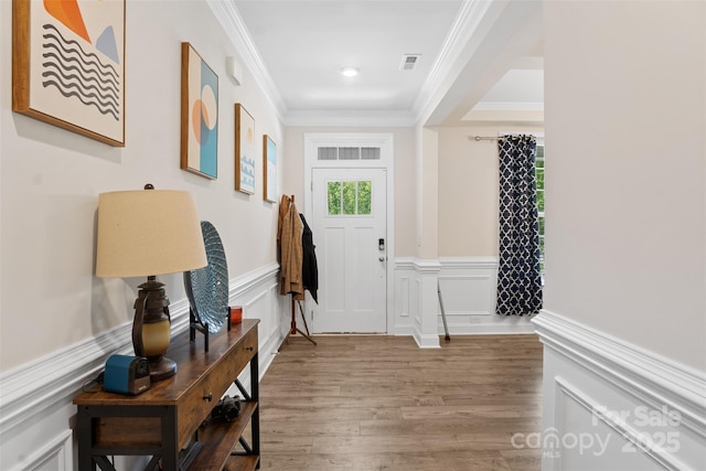 107 Hornbeam Ln, Mooresville, NC 28117 - foyer featuring ornamental molding, wood finished floors, wainscoting, a decorative wall, and recessed lighting