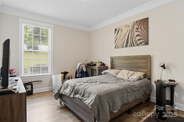 107 Hornbeam Ln, Mooresville, NC 28117 - bedroom with crown molding, wood finished floors, and baseboards