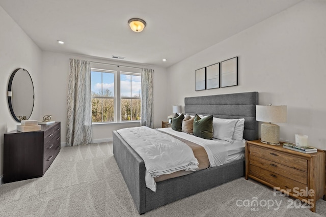 bedroom featuring light colored carpet, baseboards, and recessed lighting
