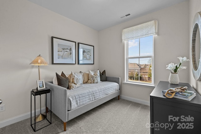 bedroom with carpet floors and baseboards