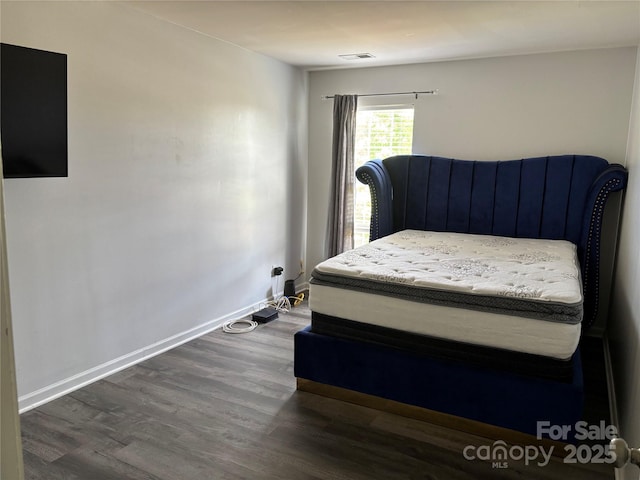 10826 Claude Freeman Dr, Charlotte, NC 28262 - bedroom with dark wood-style flooring and baseboards