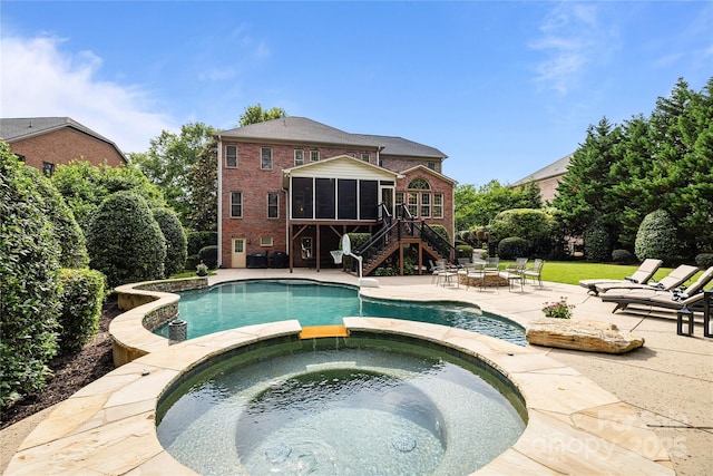 9021 Unbridle Ln, Waxhaw, NC 28173 - view of pool with a sunroom, stairs, a patio, a fire pit, and a pool with connected hot tub