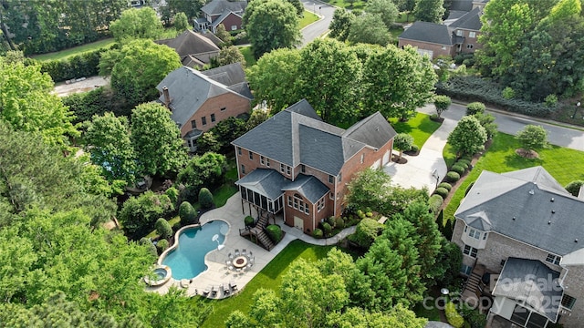 9021 Unbridle Ln, Waxhaw, NC 28173 - aerial perspective of suburban area featuring a pool area and a tree filled landscape