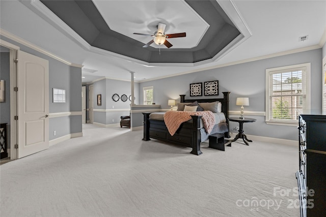 9021 Unbridle Ln, Waxhaw, NC 28173 - carpeted bedroom featuring a raised ceiling, crown molding, baseboards, and a ceiling fan
