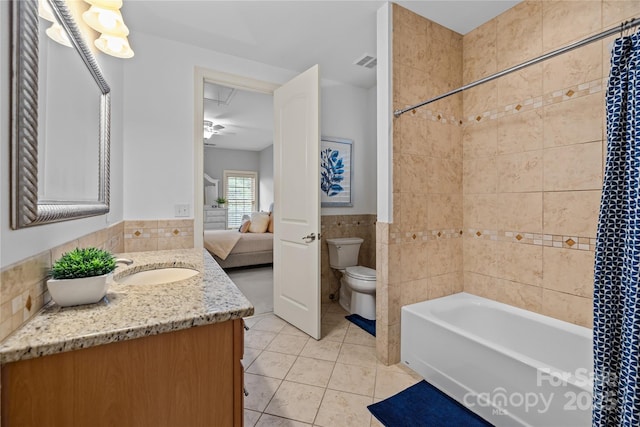 9021 Unbridle Ln, Waxhaw, NC 28173 - bathroom featuring tile walls, toilet, tile patterned flooring, vanity, and ensuite bath