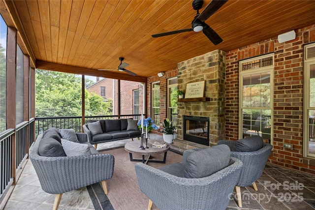 9021 Unbridle Ln, Waxhaw, NC 28173 - view of patio / terrace featuring an outdoor living space with a fireplace and a ceiling fan