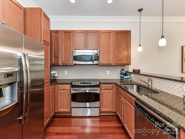2810 Selwyn Ave Unit 104, Charlotte, NC 28209 - kitchen with appliances with stainless steel finishes, a sink, dark wood-style floors, dark stone countertops, and brown cabinets