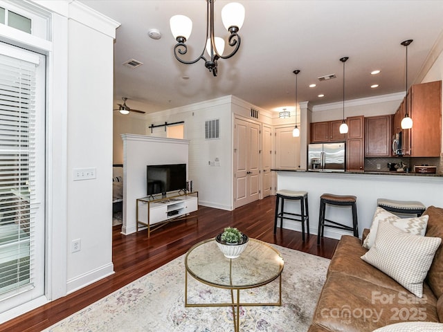 2810 Selwyn Ave Unit 104, Charlotte, NC 28209 - living room with a barn door, dark wood-type flooring, crown molding, a ceiling fan, and baseboards