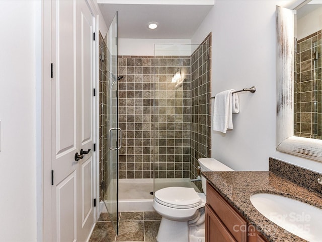 2810 Selwyn Ave Unit 104, Charlotte, NC 28209 - bathroom with vanity, toilet, a stall shower, and tile patterned flooring
