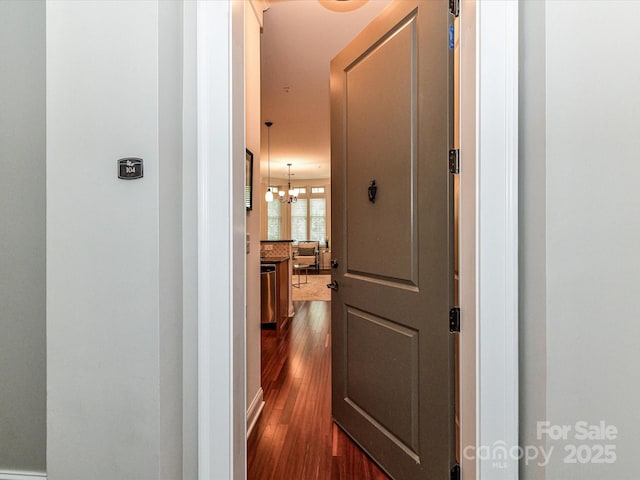 2810 Selwyn Ave Unit 104, Charlotte, NC 28209 - corridor with dark wood finished floors and a chandelier