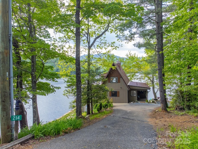 214 Sequoyah Trl, Robbinsville, NC 28771 - view of front of house featuring a chimney, driveway, and a mountain view