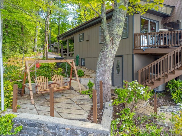 214 Sequoyah Trl, Robbinsville, NC 28771 - back of property with stairs, a wooden deck, and a patio area
