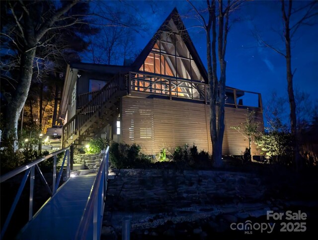 214 Sequoyah Trl, Robbinsville, NC 28771 - property exterior at twilight with stairs