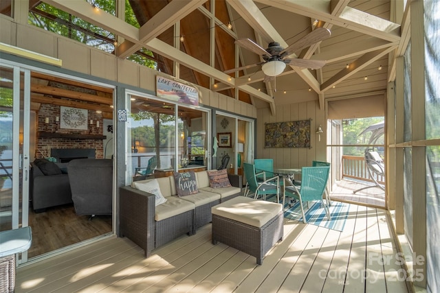 214 Sequoyah Trl, Robbinsville, NC 28771 - sunroom / solarium featuring a ceiling fan, a brick fireplace, and lofted ceiling