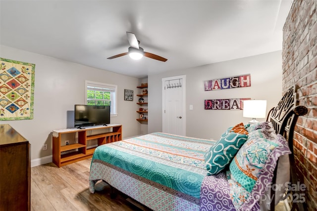 214 Sequoyah Trl, Robbinsville, NC 28771 - bedroom featuring wood finished floors, a ceiling fan, and baseboards