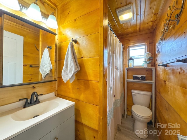 214 Sequoyah Trl, Robbinsville, NC 28771 - bathroom featuring wooden walls, toilet, vanity, wood ceiling, and wood finished floors