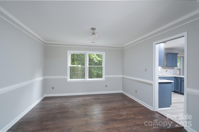 1013 Doby Springs Dr, Charlotte, NC 28262 - empty room with plenty of natural light, wood finished floors, crown molding, and baseboards