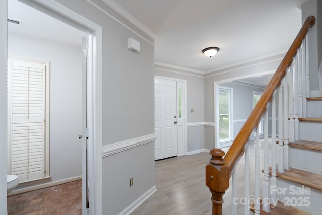 1013 Doby Springs Dr, Charlotte, NC 28262 - foyer entrance with stairway, ornamental molding, baseboards, and parquet floors