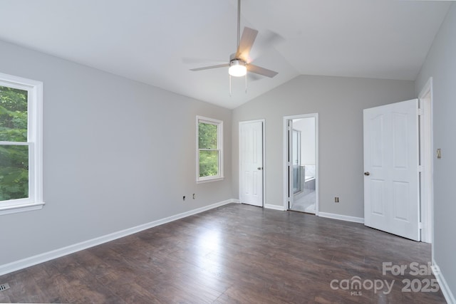1013 Doby Springs Dr, Charlotte, NC 28262 - unfurnished bedroom with lofted ceiling, dark wood-style flooring, ensuite bathroom, baseboards, and ceiling fan