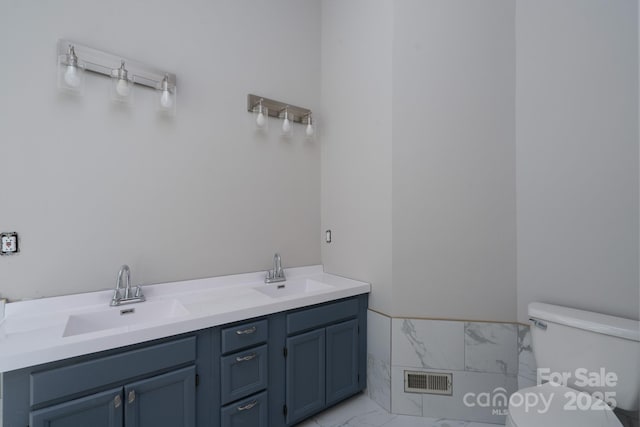1013 Doby Springs Dr, Charlotte, NC 28262 - bathroom featuring toilet, marble finish flooring, and double vanity
