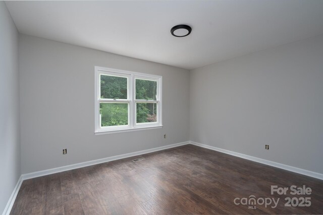 1013 Doby Springs Dr, Charlotte, NC 28262 - unfurnished room with dark wood finished floors and baseboards
