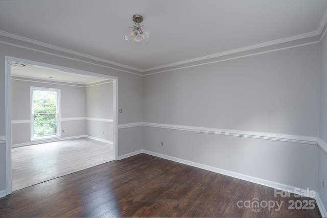 1013 Doby Springs Dr, Charlotte, NC 28262 - unfurnished room featuring dark wood-style flooring, a chandelier, baseboards, and crown molding