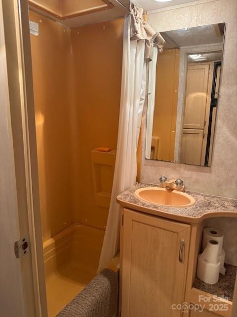 148 Trivette Trl, Mount Gilead, NC 27306 - bathroom with a shower with shower curtain and vanity