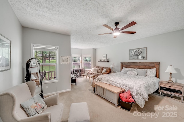 592 Woodcrest Dr, Gastonia, NC 28052 - bedroom with a textured ceiling, light colored carpet, ceiling fan, and baseboards