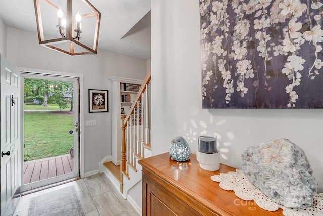 592 Woodcrest Dr, Gastonia, NC 28052 - entryway featuring stairway, a chandelier, light tile patterned floors, and baseboards