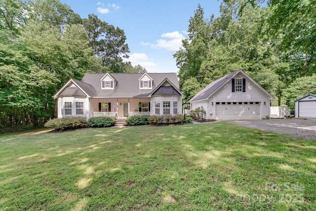 592 Woodcrest Dr, Gastonia, NC 28052 - cape cod house with an outbuilding, a porch, a detached garage, and a front lawn
