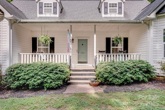 592 Woodcrest Dr, Gastonia, NC 28052 - doorway to property featuring covered porch and roof with shingles