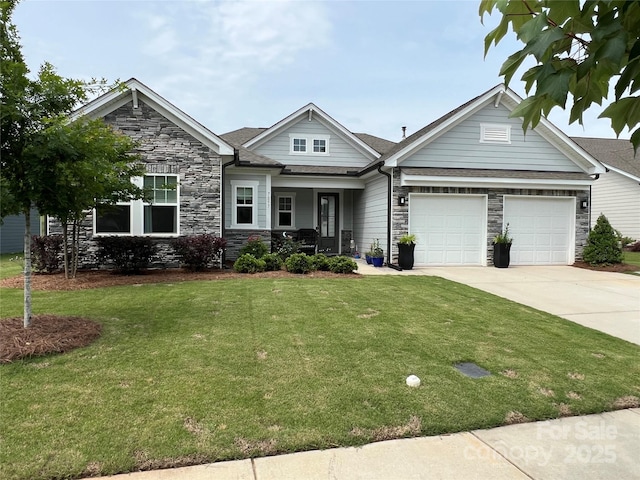 7057 Kingfisher Way, Belmont, NC 28012 - view of front facade with stone siding, driveway, a front lawn, a garage, and covered porch