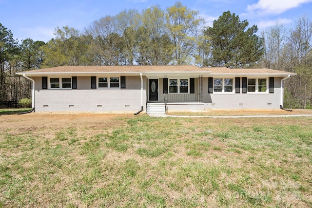 174 Maske Rd, Mount Gilead, NC 27306 - ranch-style house featuring crawl space, brick siding, a front lawn, and covered porch