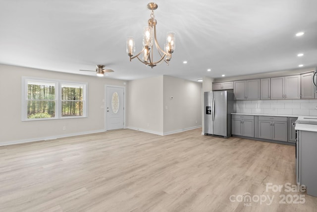 174 Maske Rd, Mount Gilead, NC 27306 - kitchen featuring stainless steel fridge with ice dispenser, gray cabinets, a chandelier, a ceiling fan, and light countertops