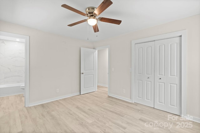 174 Maske Rd, Mount Gilead, NC 27306 - unfurnished bedroom featuring wood finished floors, a closet, baseboards, and connected bathroom
