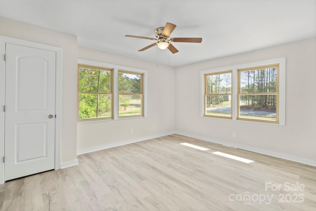 174 Maske Rd, Mount Gilead, NC 27306 - empty room with healthy amount of natural light, a ceiling fan, light wood-type flooring, and baseboards