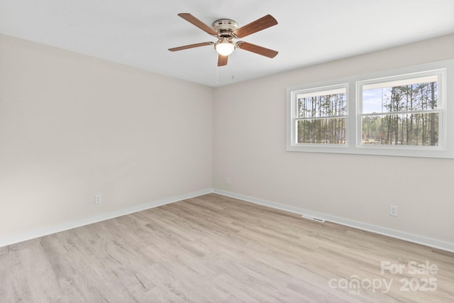 174 Maske Rd, Mount Gilead, NC 27306 - unfurnished room featuring light wood finished floors, ceiling fan, and baseboards
