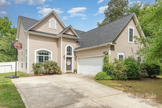 8927 Comstock Ct, Locust, NC 28097 - traditional home featuring driveway, a shingled roof, and a garage