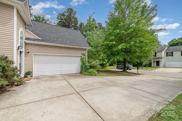 8927 Comstock Ct, Locust, NC 28097 - garage featuring concrete driveway