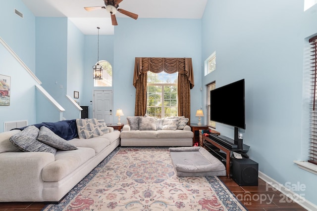 8927 Comstock Ct, Locust, NC 28097 - living room with a high ceiling, ceiling fan, wood finished floors, and baseboards