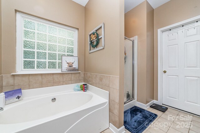 8927 Comstock Ct, Locust, NC 28097 - full bath with a bath, a shower stall, and tile patterned floors