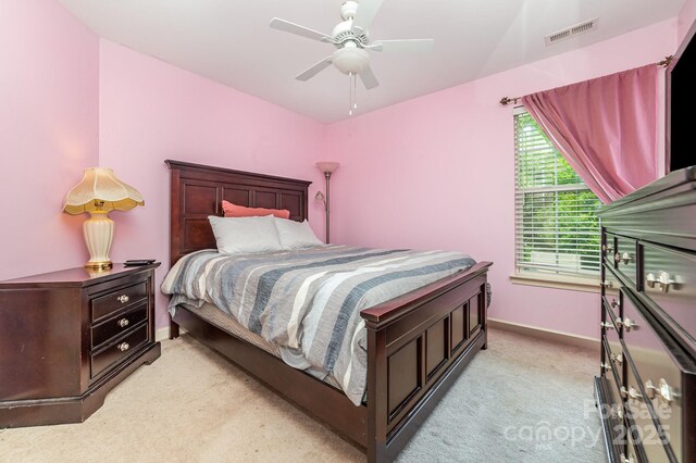 8927 Comstock Ct, Locust, NC 28097 - bedroom featuring light carpet, baseboards, and a ceiling fan
