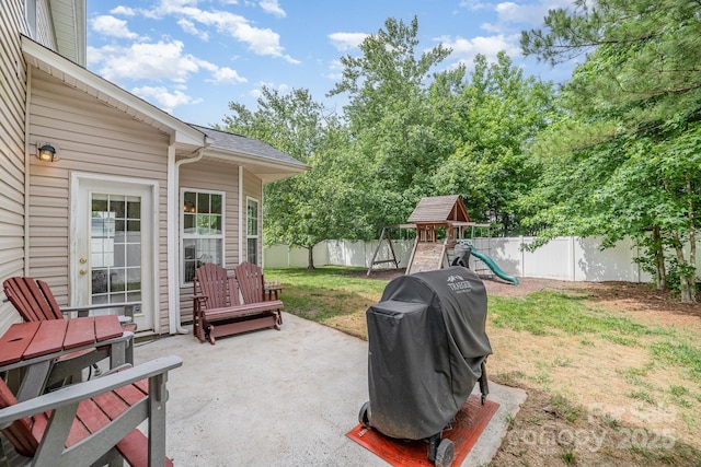 8927 Comstock Ct, Locust, NC 28097 - view of patio with grilling area and a playground