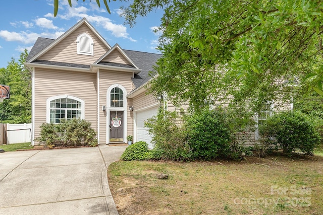 8927 Comstock Ct, Locust, NC 28097 - traditional-style home featuring an attached garage, driveway, and roof with shingles